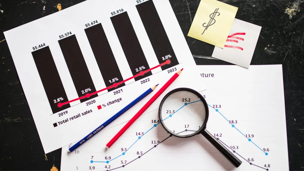 Magnifying glass over printed multi axis line chart with multiple datasets for comparing different scales